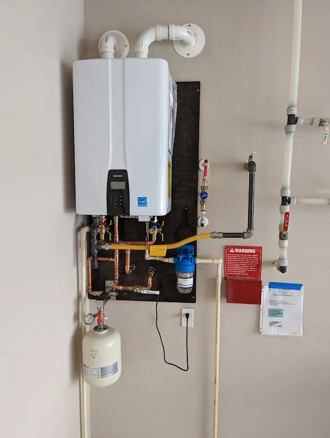 Professional plumber installing copper piping in a Santa Fe Springs home